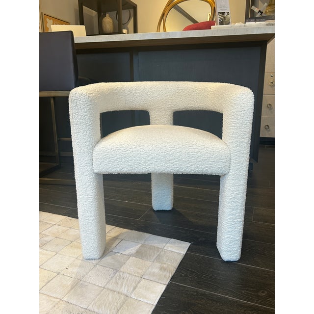 A surprisingly versatile take on a modern classic. Works great as an accent chair or desk chair. Shown in cream down faux...
