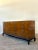 This exceptionally long Mid-Century Modern dresser embodies the sophisticated blending of sleek American design with...