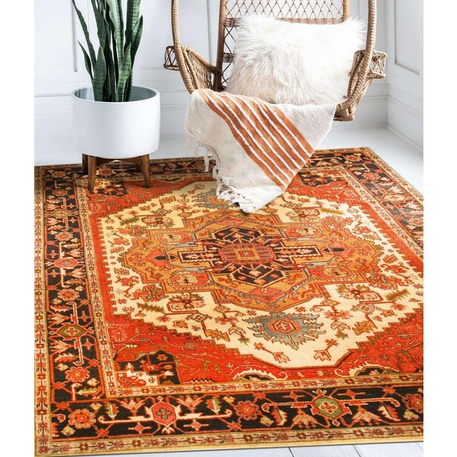 A hand-knotted wool rug, made in India and measuring 3' x 5'. Floral drawing carried across the field inside a traditional...