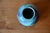 Simple yet precious, this small stoneware spherical vase tells the story of a potter passionate about his craft. Its soft,...