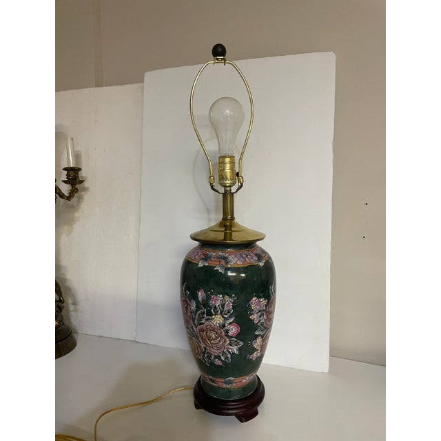 Vintage Chinoiserie table lamp. Vase form with flower design. measures 16" tall to the top of the porcelain and 27" to the...