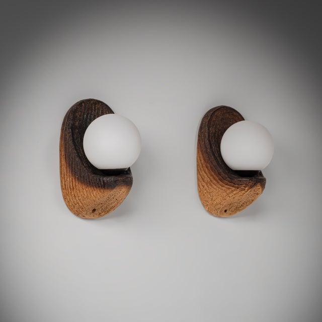 These sculptural ceramic wall lamps were produced by Doria Leuchten in Germany during the 1970s. Combining deeply textured...