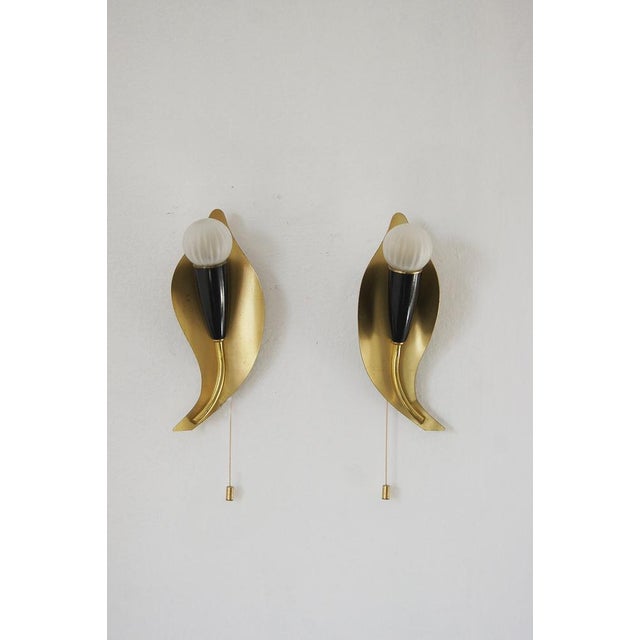 A pair of mid-century, 1950s wall sconces, Very elegant and minimalist wall lamps. Timeless Italian design at its best. Up...