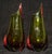 Pair of mid-century Murano vases in deep green glass, each wrapped with an applied red serpentine band, executed in the...