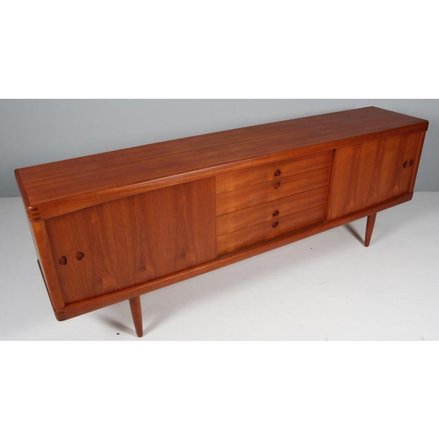 Danish Cabinetmaker sideboard in teak. Sliding doors and drawers. Visible joints. Made in the 1960s This piece is...