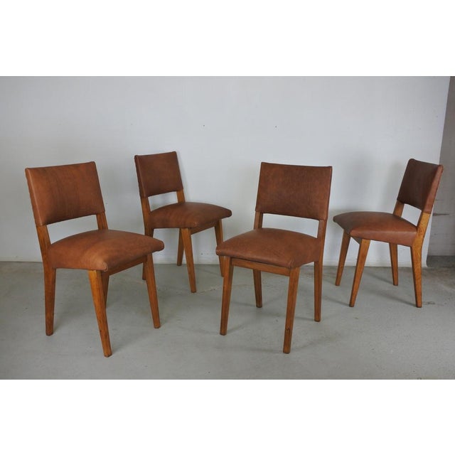 Set of 4 dining room chairs attributed to Jens Risom and Knoll International. Solid oak wood and leather. Newly...