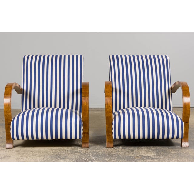 A handsome and refined pair of late 1930s French Art Deco lounge chairs, sourced from Provence, France. Each chair is...