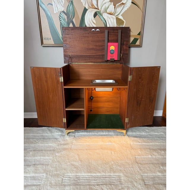 Possibly one of our coolest items yet! This is a sewing machine cabinet that was converted into a bar cabinet and is a...