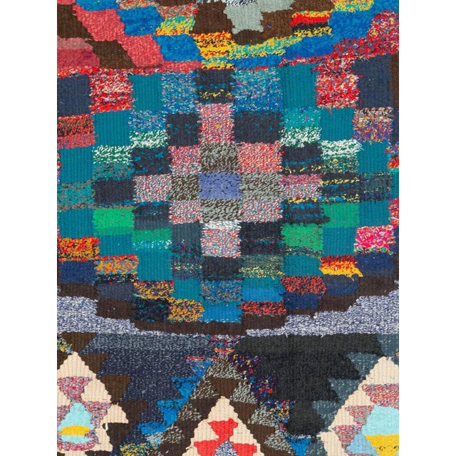 A striking Mid-20th century Persian flatweave kilim distinguished by its bold geometric composition and richly varied...