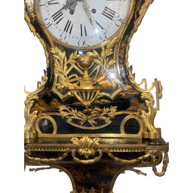 An exceptional and monumental early 19th century French chinoiserie wall clock complete with its original matching wall...