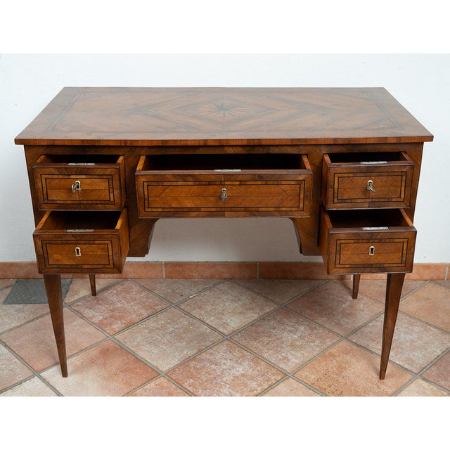 : Antique Louis XVI Neapolitan walnut burl centerpiece desk from the second half of the 18th century. The front features...