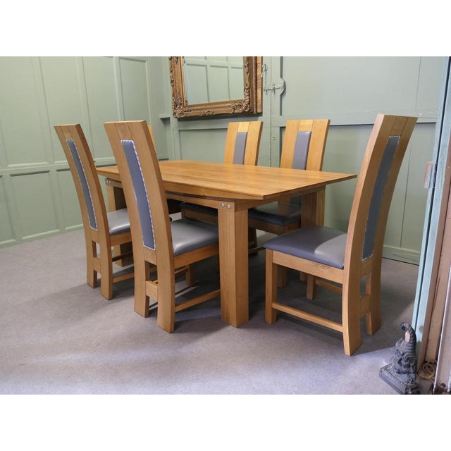 Golden Oak Modernist Dining Table and 6 Chairs This is a superb quality heavy golden oak table it comes with a matching...