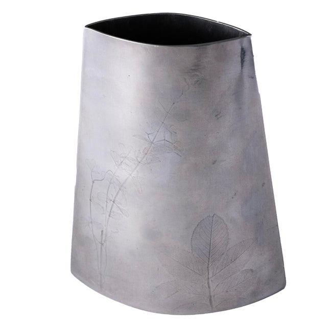 Beautiful pewter vase with botanical imprints.