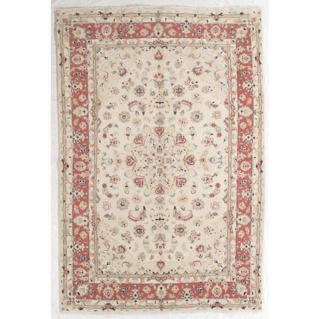 Vintage Hand-knotted Persian Tabriz rug from northwest Iran, known for its fine weave and detailed floral patterns....