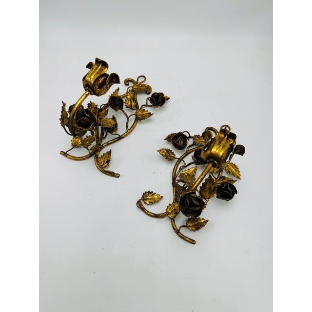 These lovely gold sconces hang and are candle holders! Marked Italy, the finish is a rich dark gold.