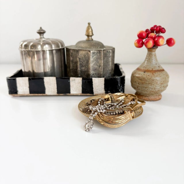 This beautifully worn bronze dragon vide poche is equally as captivating as it is subtly elegant. Features three dragons...