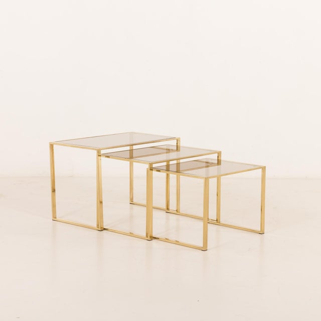 This elegant set of three italian brass nesting tables comes from the 1970s, and perfectly reflects the glamorous...