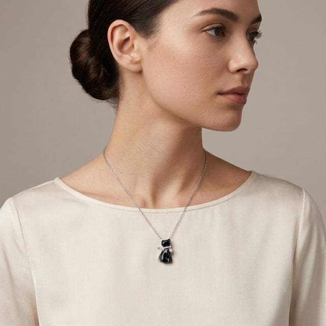 Elevate your jewelry collection with this stunning 14k White Gold Pendant Necklace, featuring a captivating black cat...