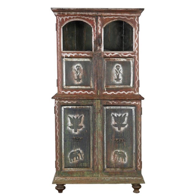 Rich in character and folk-art charm, this Antique Indian Painted Teakwood Bookcase/Armoire is a remarkable example of...