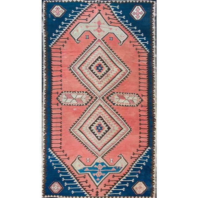 A beautiful early 20th century Turkish Konya Kilim rug with two large diamond medallions flanked by stylized floral...