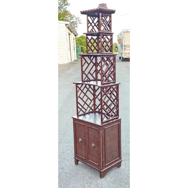 Late 20th Century Chinese Chippendale Pagoda-Style Rattan graduated Bookcase Étagère Cabinet. Measure 22" in width, 15.5"...