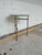 Stylish Caracole Concentric Side Table. Round marble top with white/gray colors. Antiqued brass metal legs. Original...