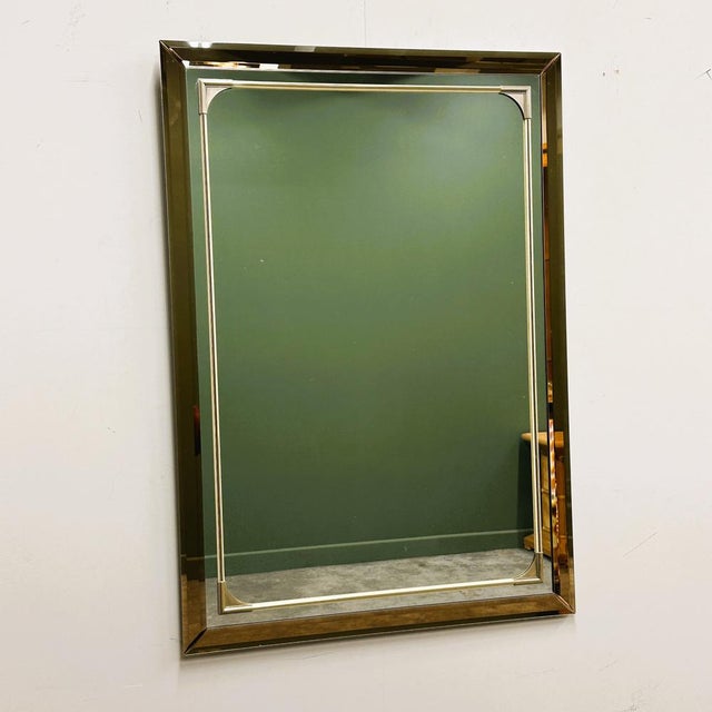 A refined and highly decorative 1980s German mirror by Schöninger, featuring a striking bronze-tinted mirrored frame...