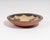 A pottery bowl by the Santo Domingo potter Hilda Coriz. Signed to the underside, this shallow bowl has a stylized bird...