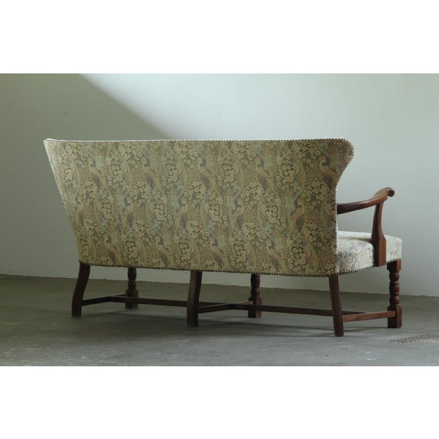 A beautiful Solid Oak Sofa from the 1940s featuring two spacious armchairs as an extra option to match. The coach was...