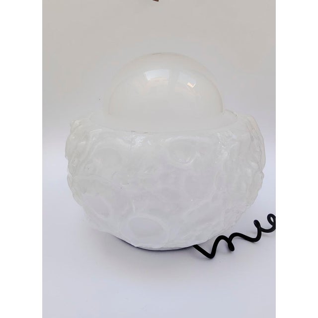 Osso Series Table Lamp Design attributed to Mazzega Vintage 1970s design Composed of a thick white glass lower section...