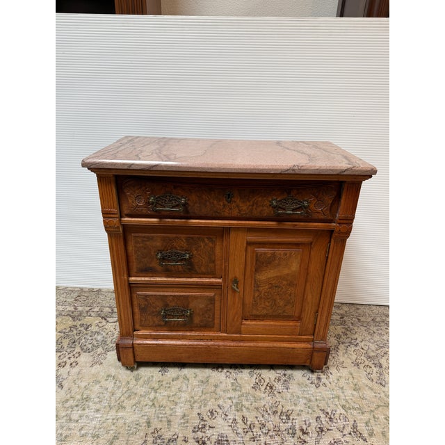 Design Plus Gallery presents a Washstand from the Late 19th Century. This commode, or washstand, is made from walnut wood...