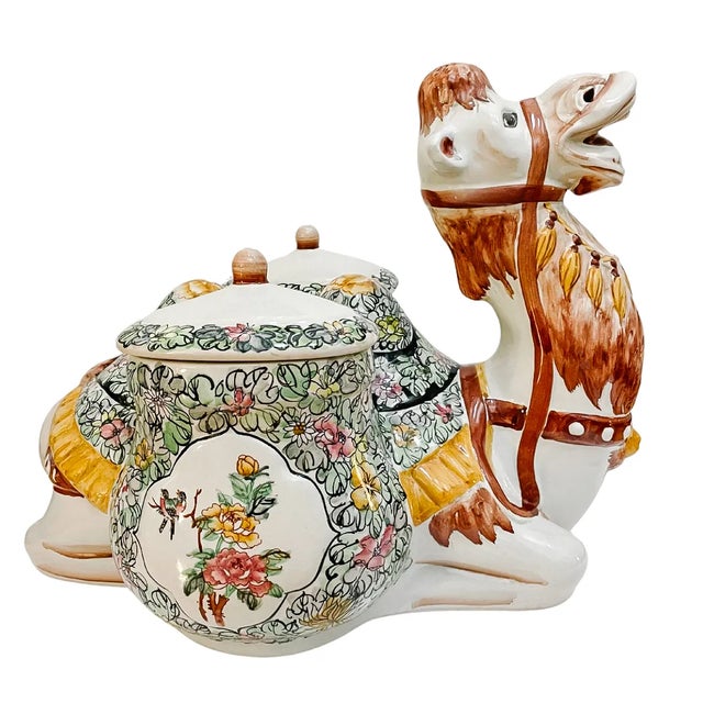 A magnificent and highly decorative large ceramic canister crafted in the shape of a kneeling camel. Design is very...