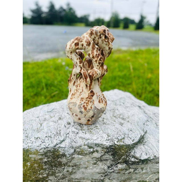 This is a striking and highly sculptural vintage pottery vase with a distinctly organic, almost coral-like appearance....