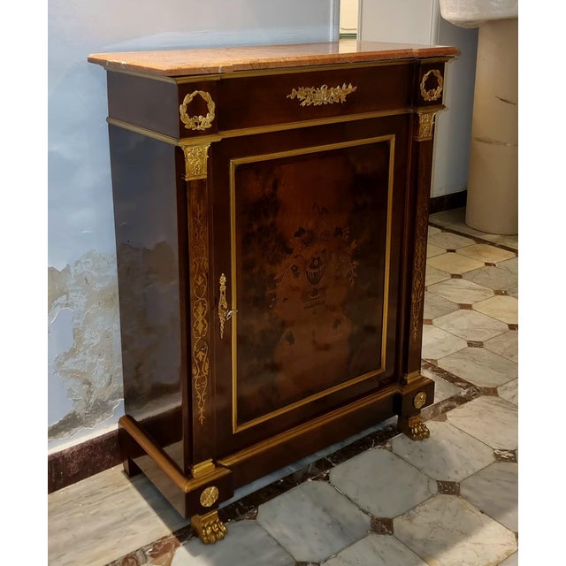 Enhance your interior with this magnificent Louis XVI-inspired commode cabinet, a sophisticated statement piece that...
