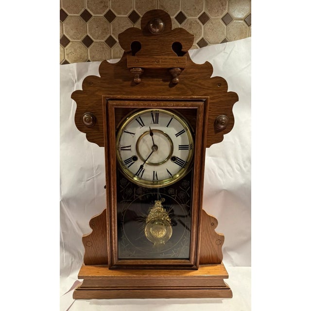 This listing is for an antique parlor mantel clock made by the New Haven Clock Co. The clock appears to be in overall good...