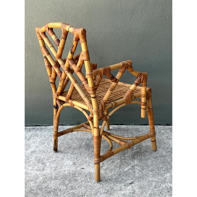 Crafted in China during the 20th century, this vintage Chinese Chippendale armchair beautifully merges Eastern organic...
