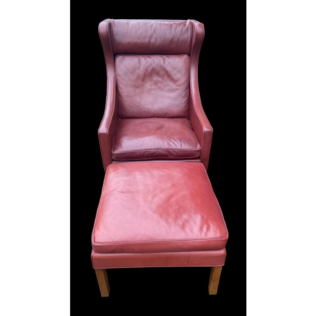 This Chair and footstool are in very good original condition, no holes or tears in the Indian red leather, nor any...