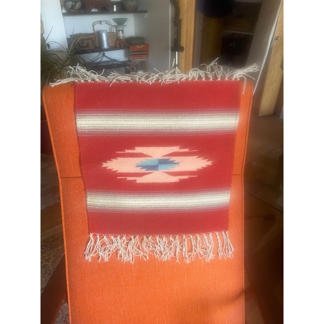 Vintage New Mexican wool Chimayo tapete weaving, orange, pink and blue central image, earth tone stripes. Color and style...
