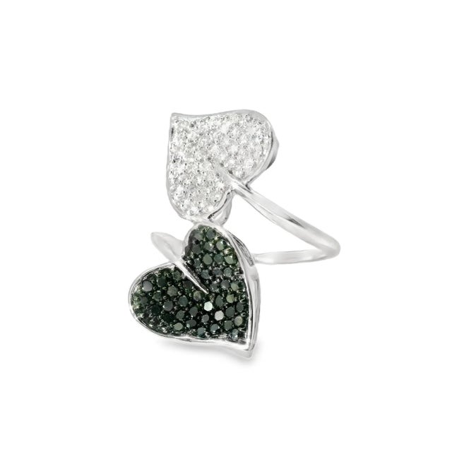 Add a touch of elegance to your collection with this 10K White Gold Diamond Band. This stunning piece features a beautiful...