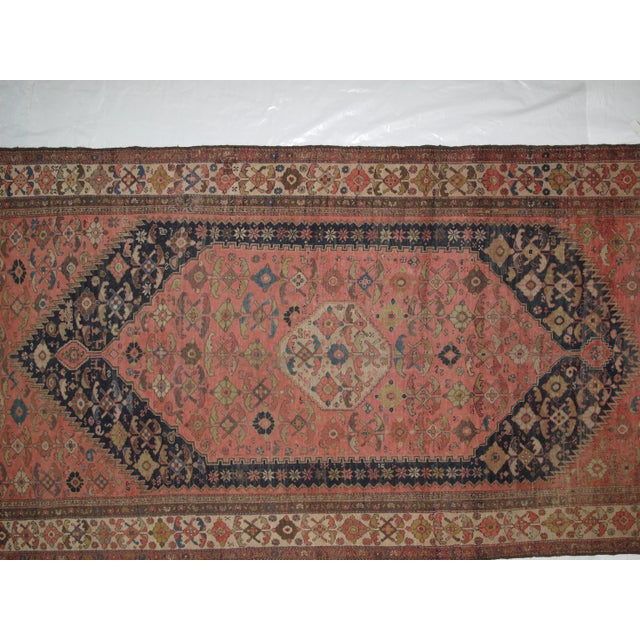 This masterpiece is a wool pile genuine hand woven antique Persian Malayer in excellent condition. The rug was made in the...