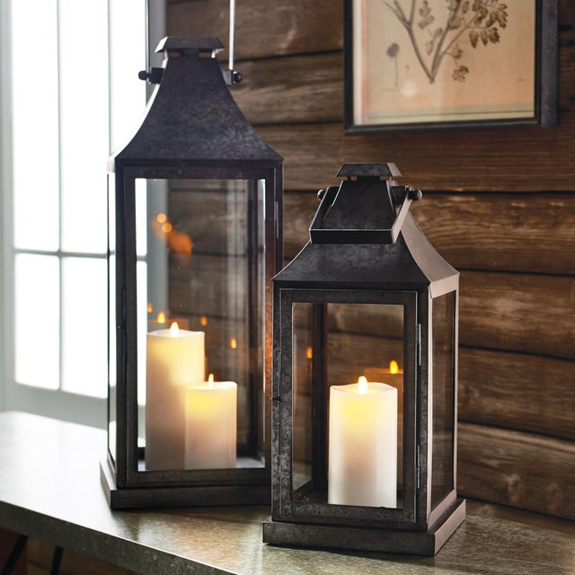 In a raw, unfinished metal, this outdoor lantern adds an industrial touch to any space. Add a selection of our LightLi...