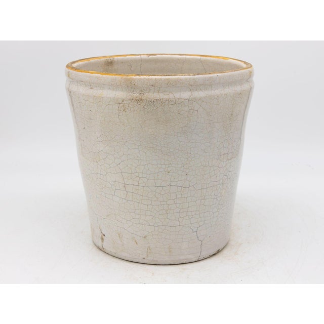 This 19th-century French confit pot features a classic glazed stoneware body with traditional dual handles, both...