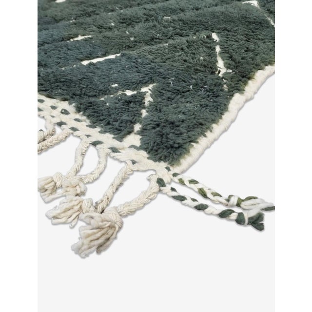 Boujad Rug | Handwoven Berber Wool Rug with Forest Green Concentric Diamond Pattern This bold Boujad rug features a deep...