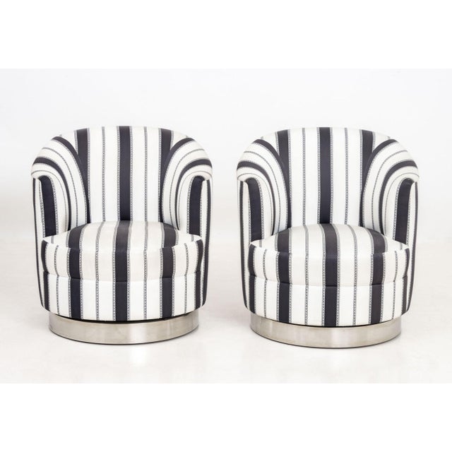Pair of Contemporary Silk Blend Upholstered Swivel Tub Chairs, on chrome-plated swivel bases. 29.75" H x 24.5" W x 25" D;...