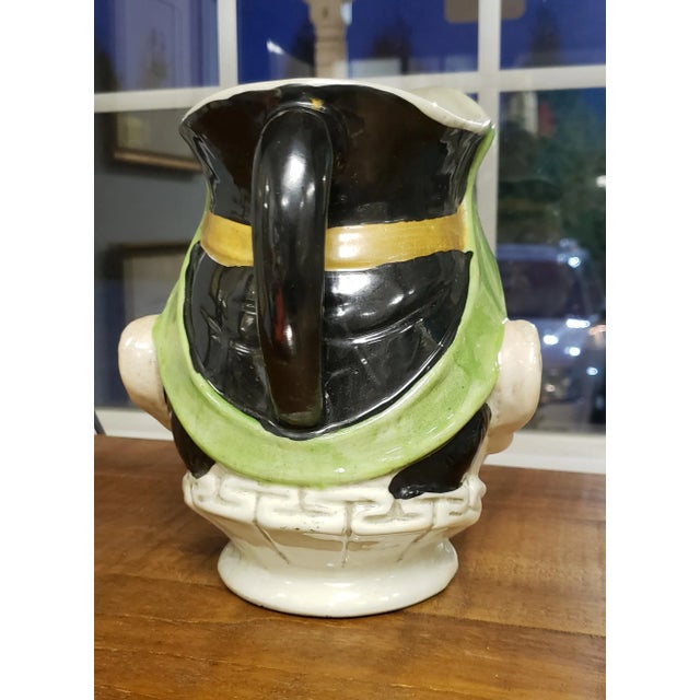 7.5" antique Sarreguemines Majolica pitcher featuring a Jolly Rotund Fellow, circa 1860 It is incredibly rare to find...