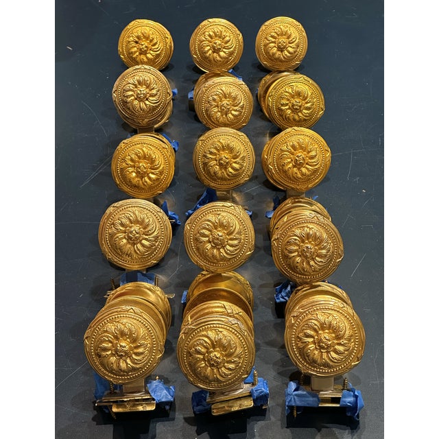 15 Sherle Wagner Floral Ribbon and Reed Door Knob Sets with Ribbon and Reed Back Plates. Burnished Gold Finish.