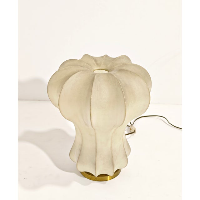 A masterpiece of mid-century Italian design, the "Gatto" table lamp was created by Achille and Pier Giacomo Castiglioni...