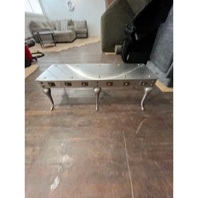 Fabulous style and well crafted in the style of a English Footman recreated as a cocktail or coffee table. Steel with...