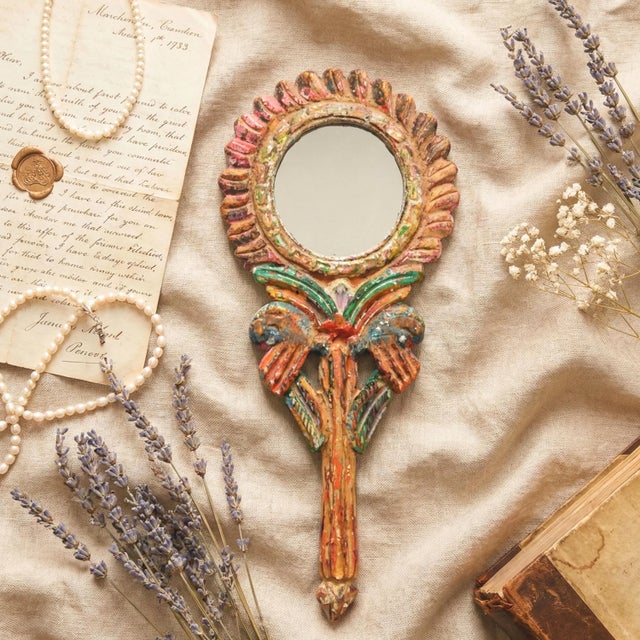 Bring the soul of a bygone era to your dressing table with this exquisite Handcrafted Antique Wood Hand Mirror. More than...