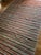 A vibrant and expressive piece, this vintage striped kilim brings together bold color and modern sensibility within a...